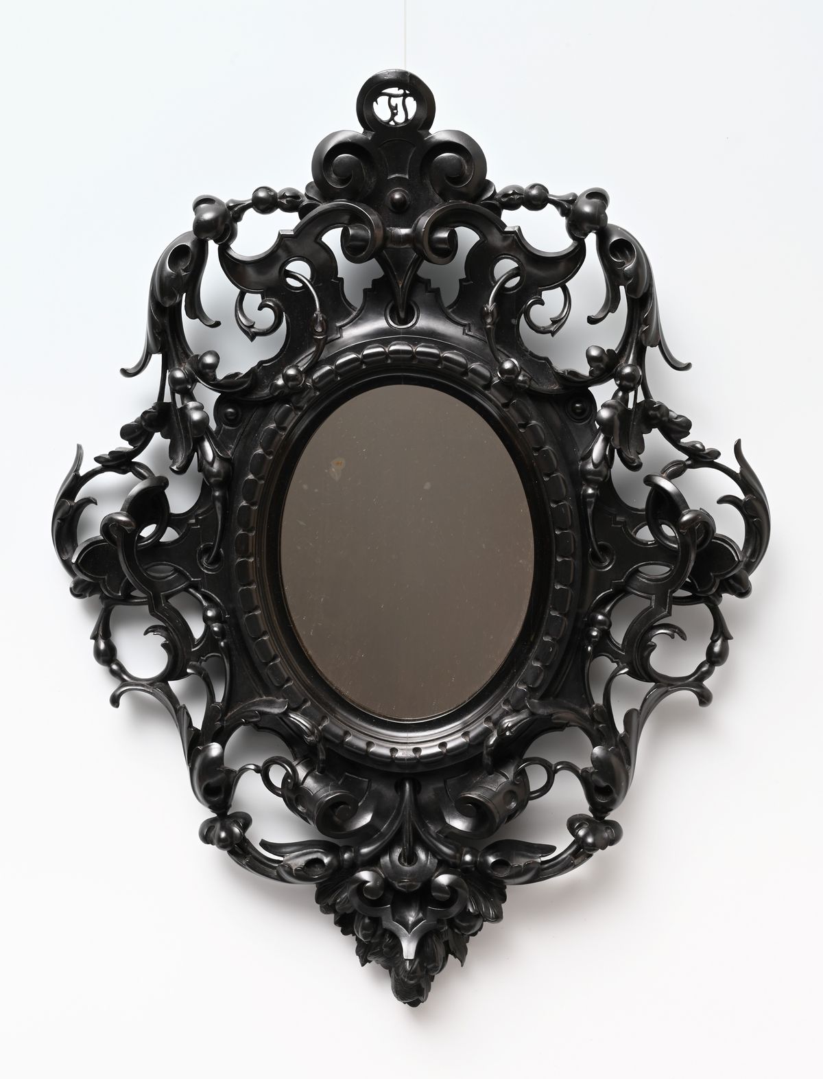 A decorative mirror. - image 1