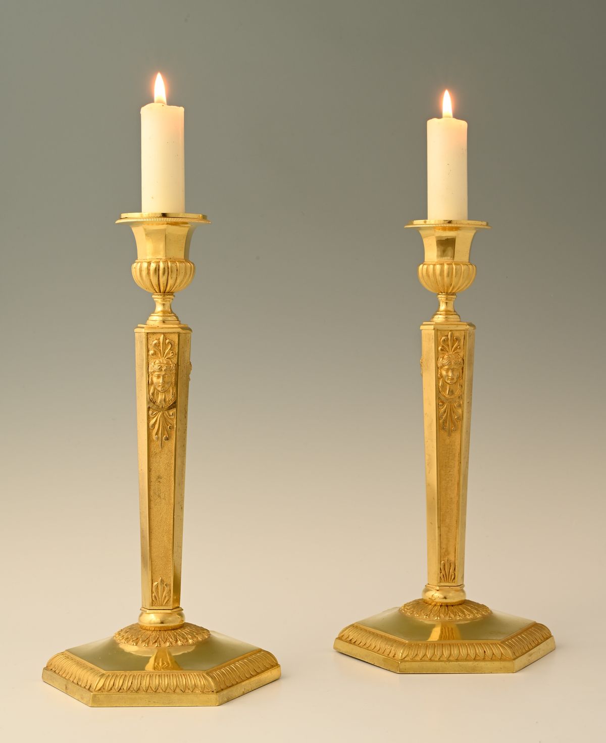 A pair of  ormolu bronze Empire candle sticks - image 1