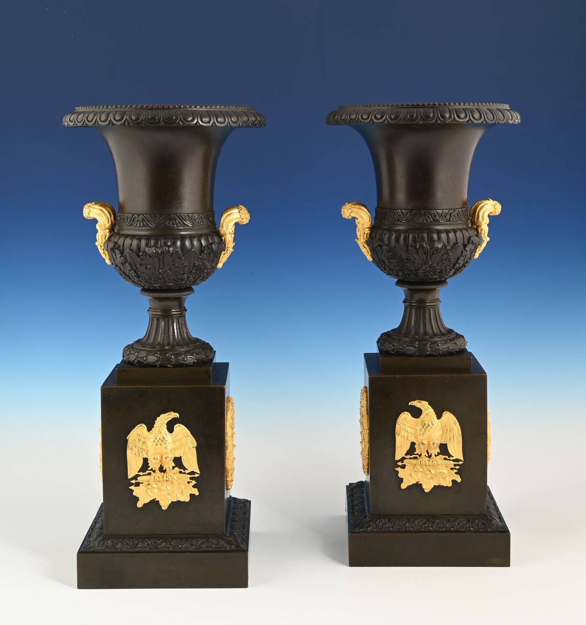 A pair of French Empire patinated bronze and ormolu ewers - image 1