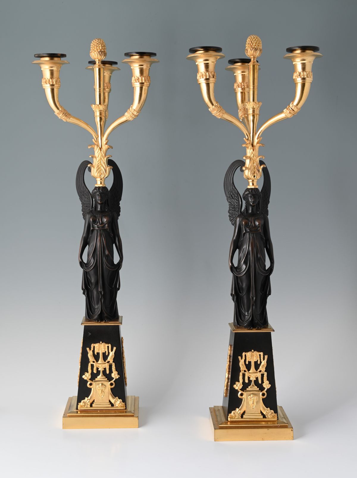 A pair of decorative candle holders - image 1
