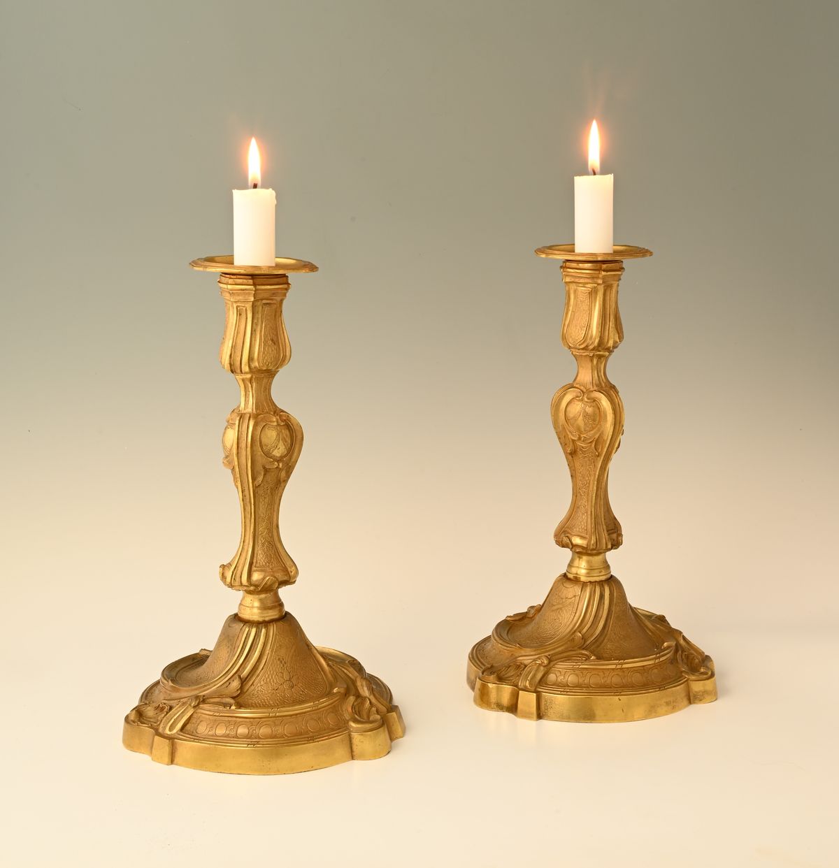 A pair of large fire-gilded bronze candlesticks in the Louis XV style. - image 1