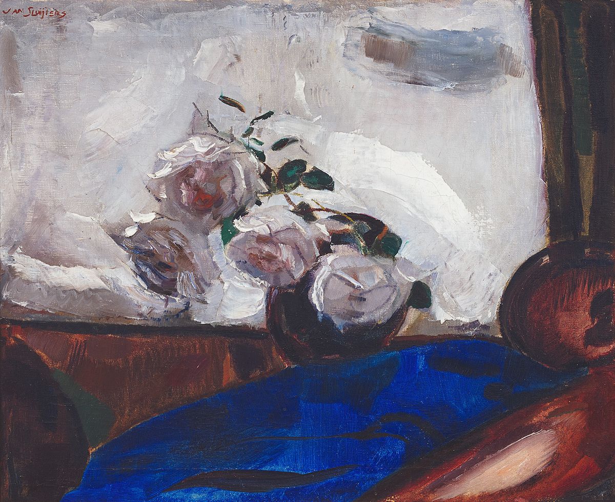 Still life with roses and a blue background