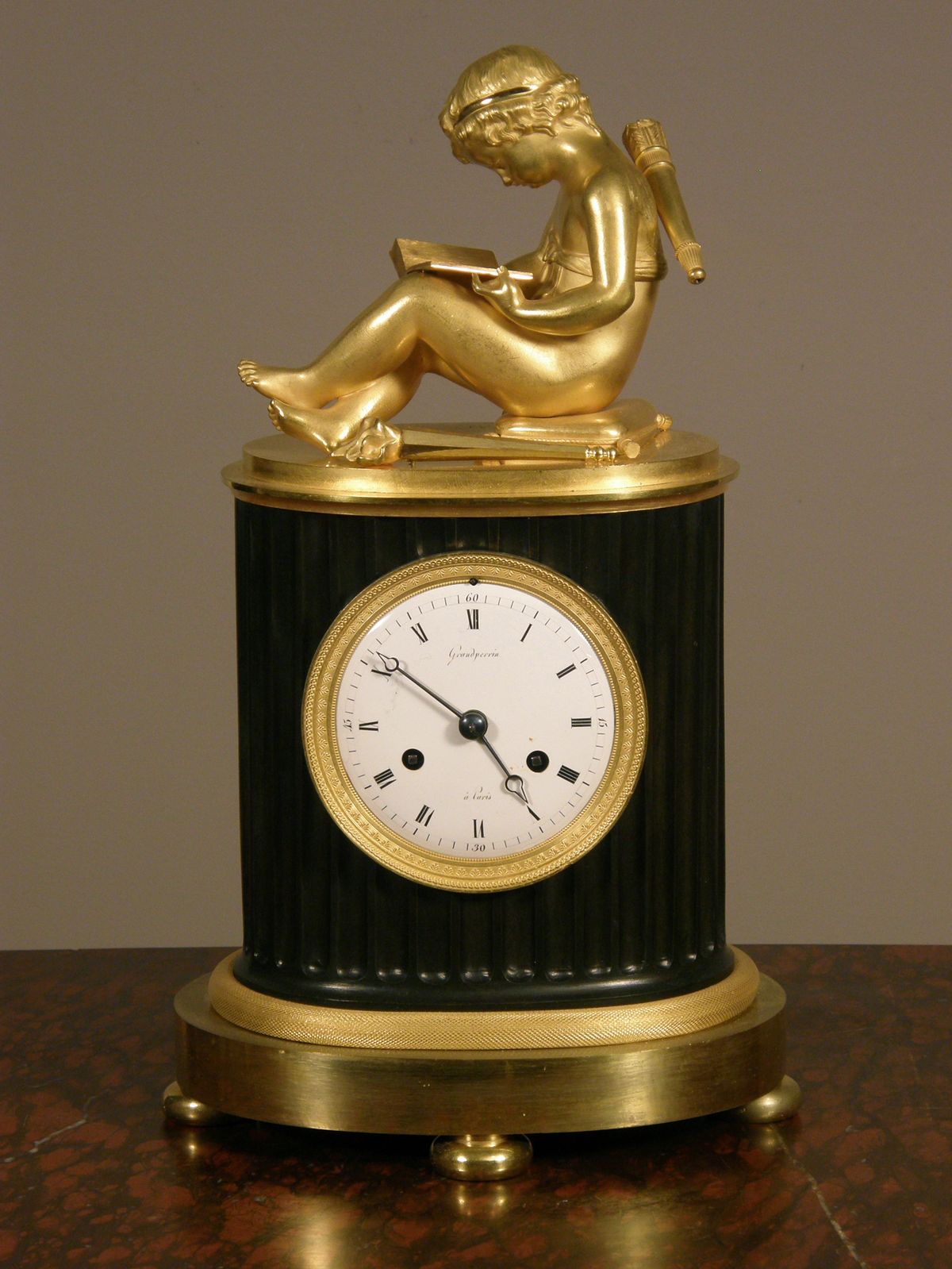 A small French Empire patinated and ormolu sculptural mantel clock Grandperrin à Perrin circa 1805. - image 1