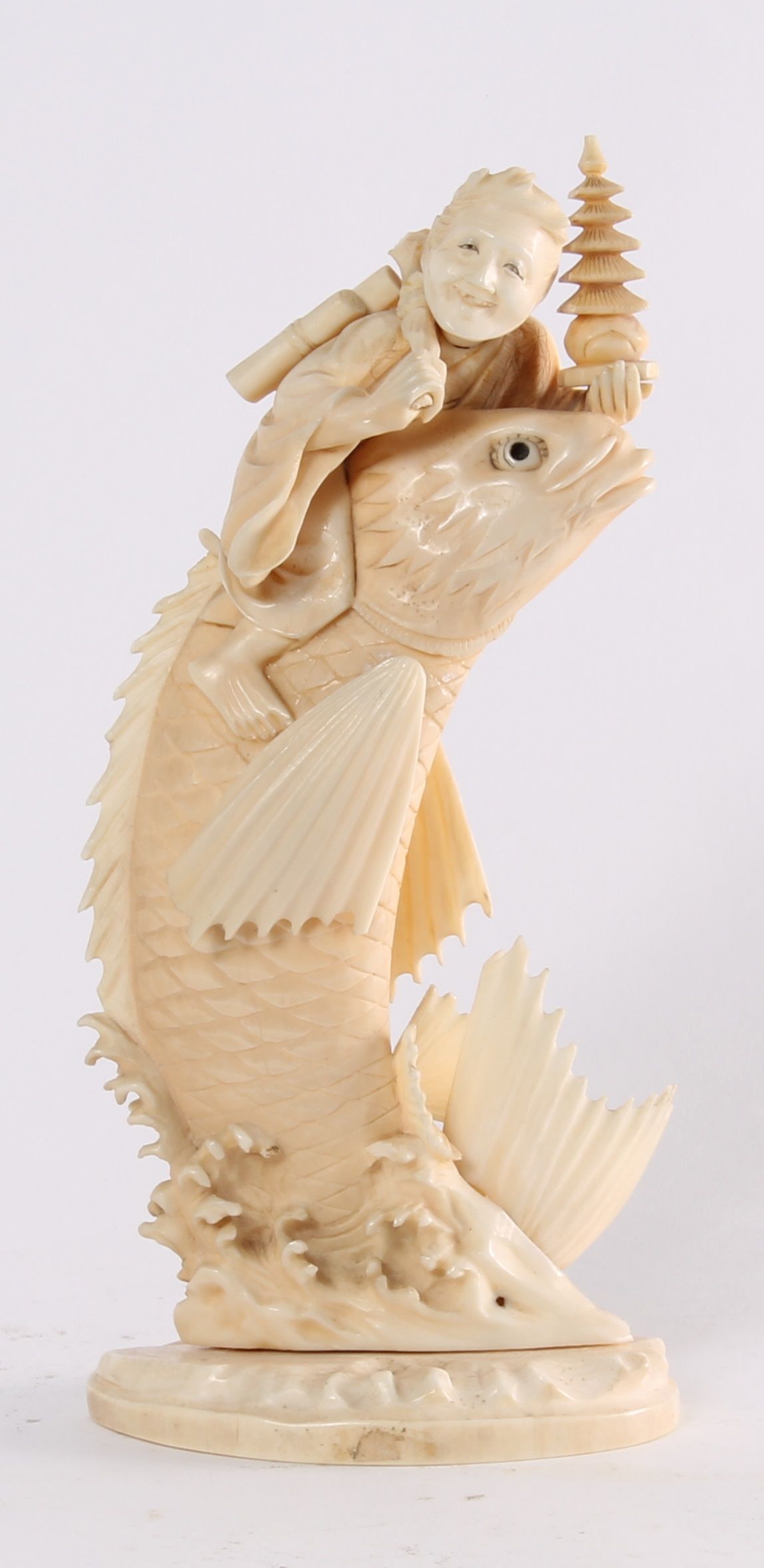 'Man on a Carp', a Japanese carved ivory sculpture, circa 1880 - image 1