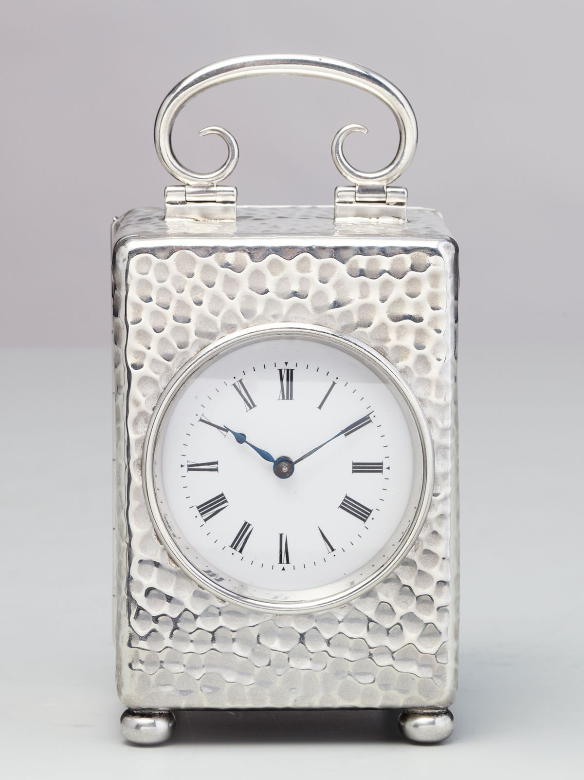 A small English silver travelling clock by William Comyns, circa 1900 - image 1
