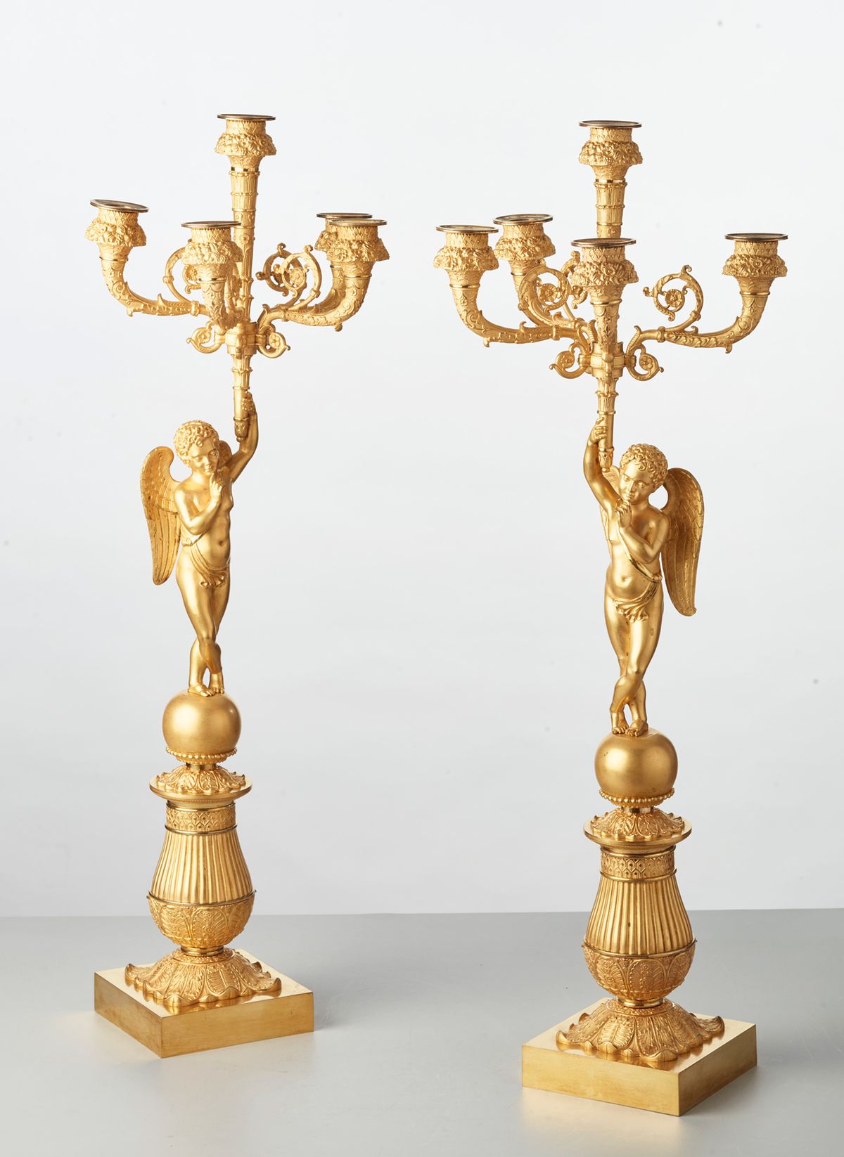 A pair of French bronze five-arm candlesticks with angels, circa 1830 - image 1