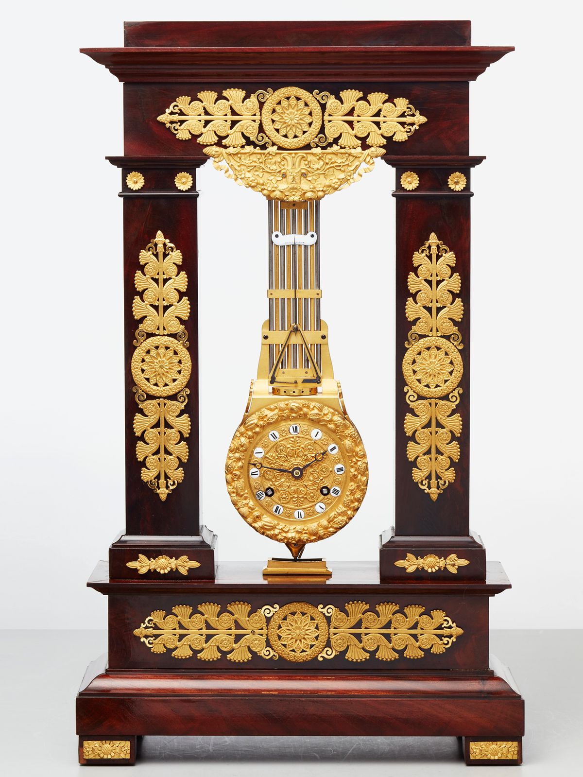 A rare French mahogany and bronze oscillating mantel clock, circa 1830 - image 1