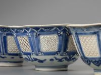 A set of three matching octagonal reticulated blue and white bowls - image 2