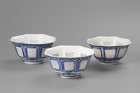 A set of three matching octagonal reticulated blue and white bowls - image 1