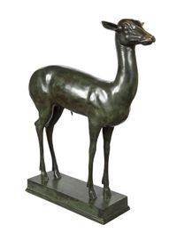 An elegant bronze sculpture of a fawn - image 1