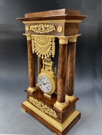 A French mahogany ormolu mounted portico mantel clock with oscillating movement, Empire ca. 1820-30. - image 1