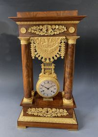 A French mahogany ormolu mounted portico mantel clock with oscillating movement, Empire ca. 1820-30. - image 2
