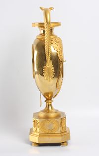 A large French Empire ormolu urn mantel clock with mythical animals, circa 1800 - image 6