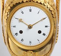 A large French Empire ormolu urn mantel clock with mythical animals, circa 1800 - image 8
