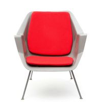 Wim Rietveld (1924-1985) and André Cordemeyer (1924-1998) An early no. '416' chair, 1957, Netherlands  The shell constructed out of glass fibre reinforced polyester, with velcro secured red back and seat pad, on a lacquered bar steel frame.  73x69x72 cm  Provenance: the chair is photographed together with its first owner in 1958. Photograph supplied by the current owner, a relative of the sitter. - image 3