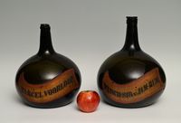 A set of green glass liqueur bottles - image 1