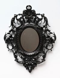 A decorative mirror. - image 1