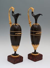 A pair of French Empire patinated bronze and ormolu ewers - image 1