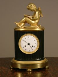 A small French Empire patinated and ormolu sculptural mantel clock Grandperrin à Perrin circa 1805. - image 1