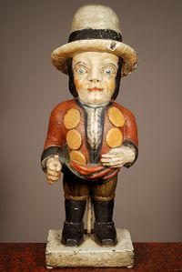 A multicoloured carved sculpture of a hunchback with remarkable buttons on his jacket, circa 1850 - image 1