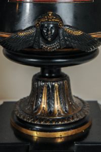 A fantastic black marble ‘retour de l’Egypt’ mantle clock with two side pieces. - image 6
