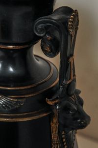 A fantastic black marble ‘retour de l’Egypt’ mantle clock with two side pieces. - image 2