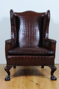 A very unusual and chic crocodile upholstered wing chair. - image 2