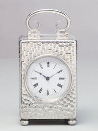 A small English silver travelling clock by William Comyns, circa 1900 - image 1