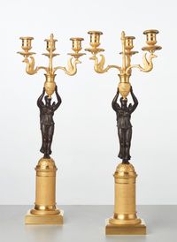 A pair of French gilt candlesticks with patinated bronze angels, circa 1820 - image 1