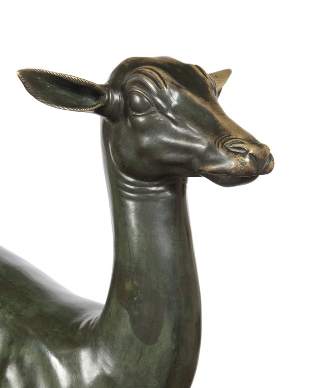 An elegant bronze sculpture of a fawn - image 3