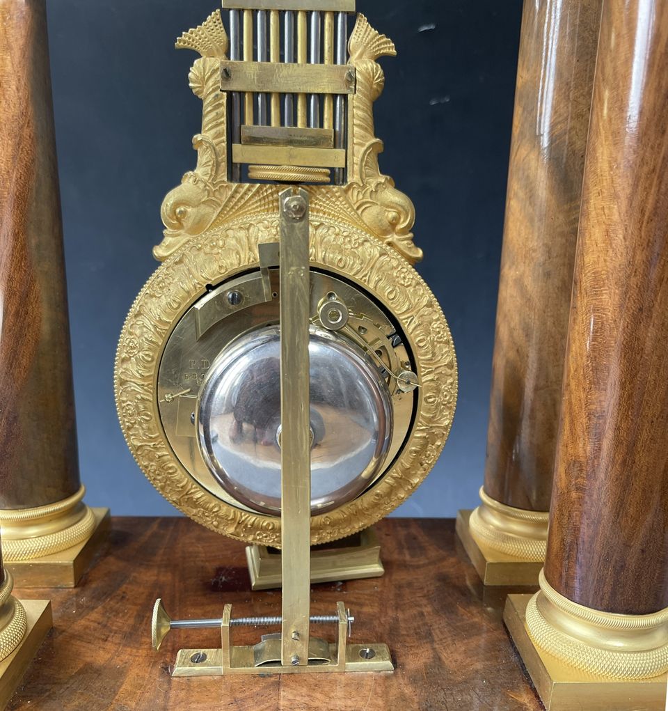 A French mahogany ormolu mounted portico mantel clock with oscillating movement, Empire ca. 1820-30. - image 6