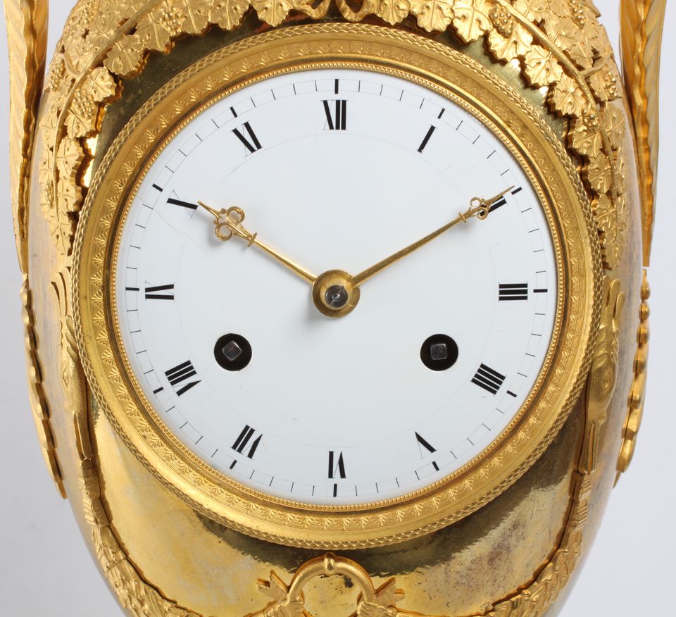 A large French Empire ormolu urn mantel clock with mythical animals, circa 1800 - image 8