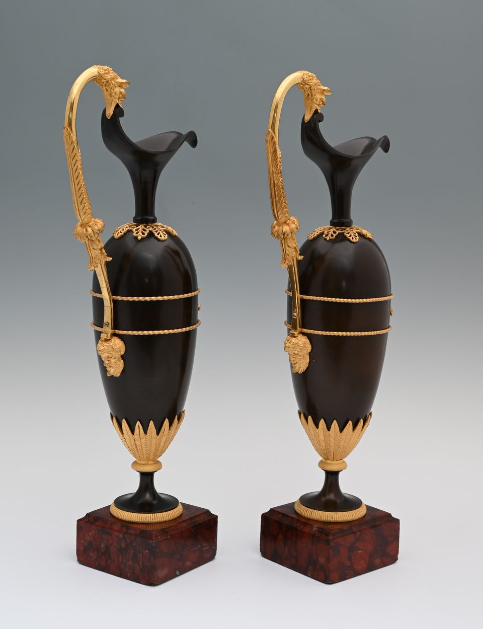 A pair of French Empire patinated bronze and ormolu ewers - image 3