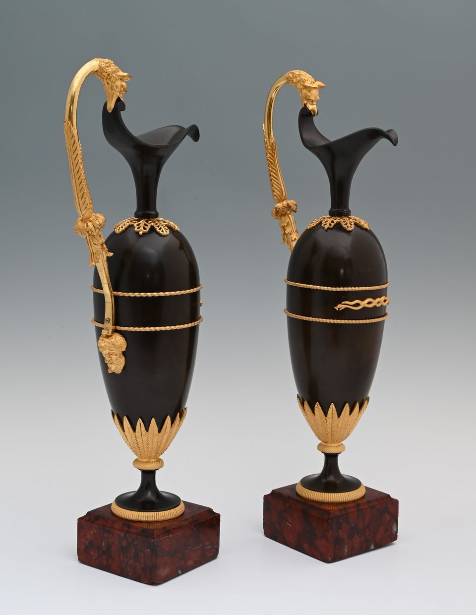 A pair of French Empire patinated bronze and ormolu ewers - image 2