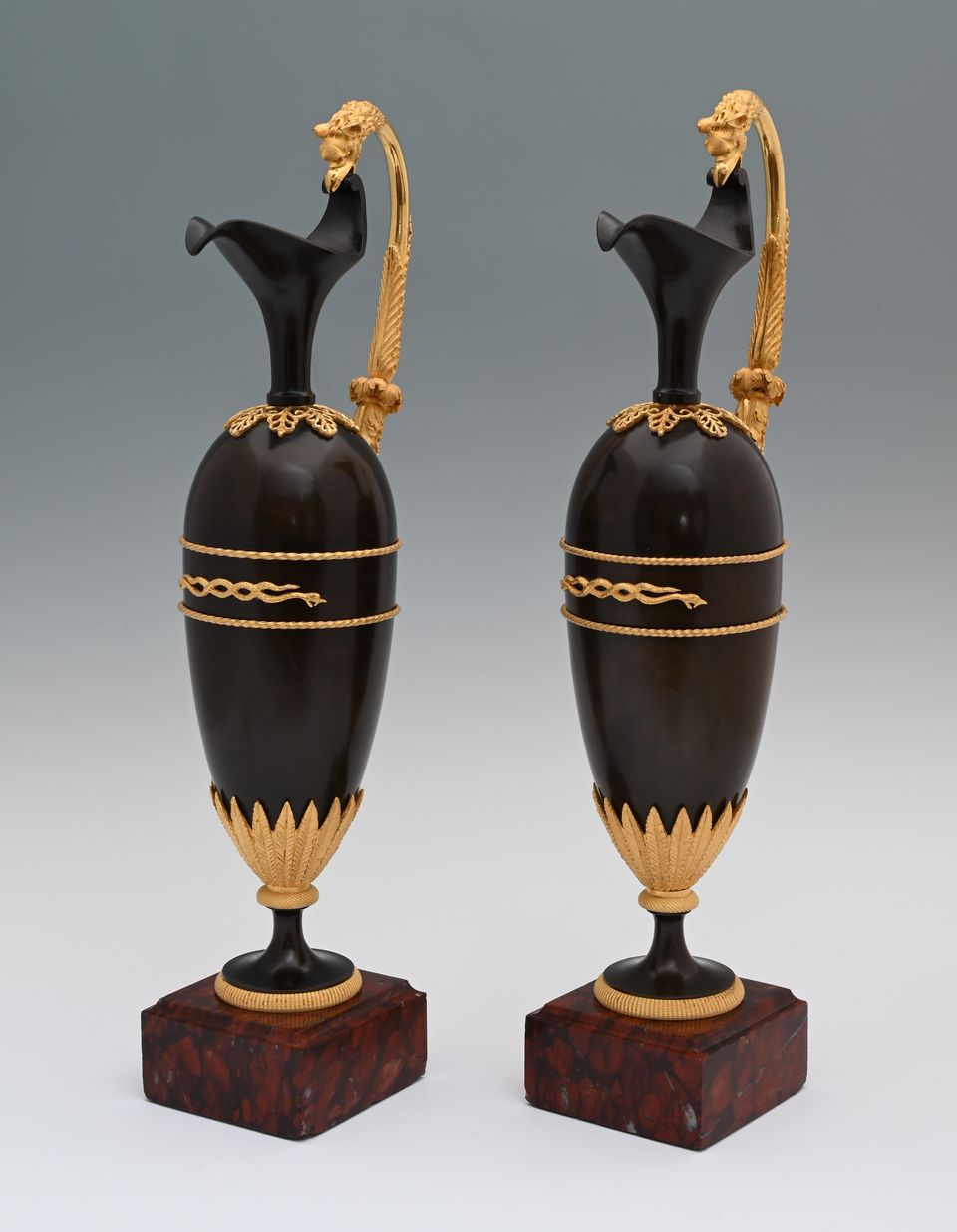A pair of French Empire patinated bronze and ormolu ewers - image 4