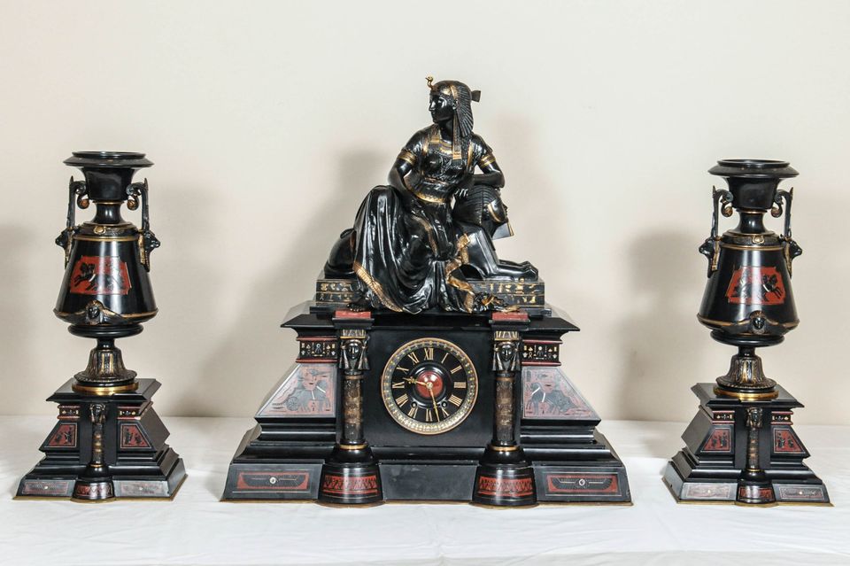 A fantastic black marble ‘retour de l’Egypt’ mantle clock with two side pieces. - image 10