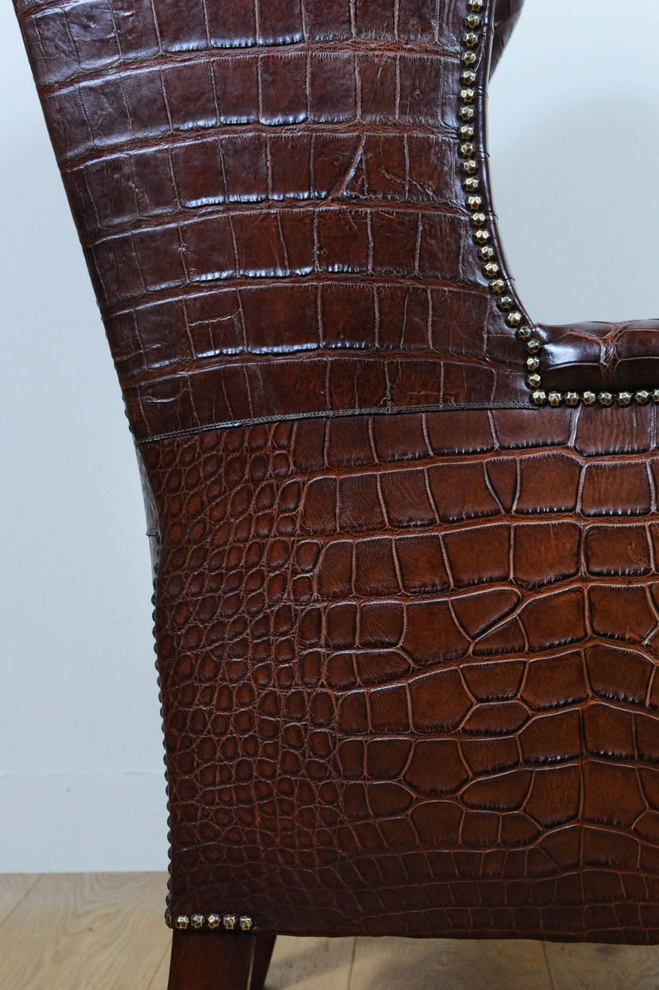 A very unusual and chic crocodile upholstered wing chair. - image 9