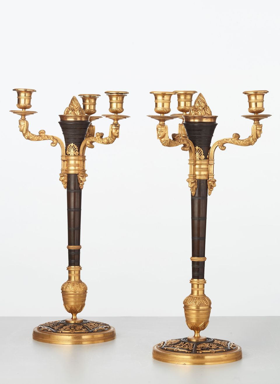 A rare pair of European four-light gilt bronze ‘Directoire’ candlesticks, circa 1810 - image 2